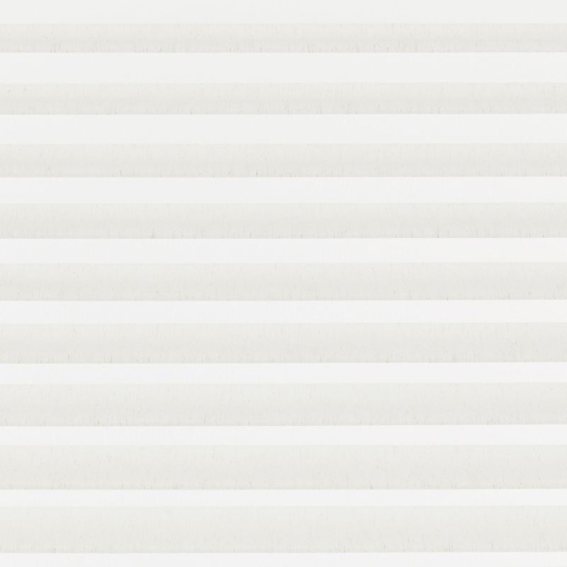 Zebra fabric roller blind covering entire window, with alternating opaque and sheer horizontal bands. Bands aligned to filter bright daylight, producing soft, evenly diffused light in a neutral room.