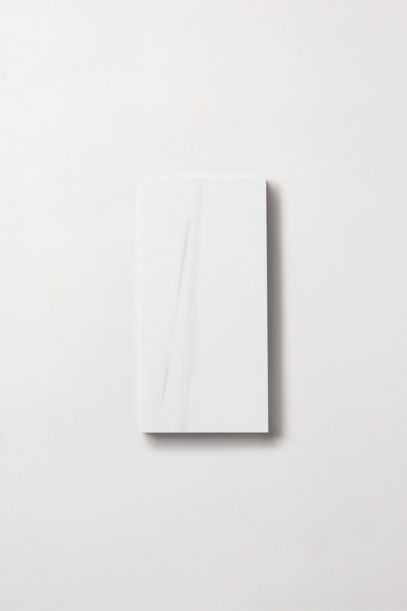 a white rectangle tile on a white background.