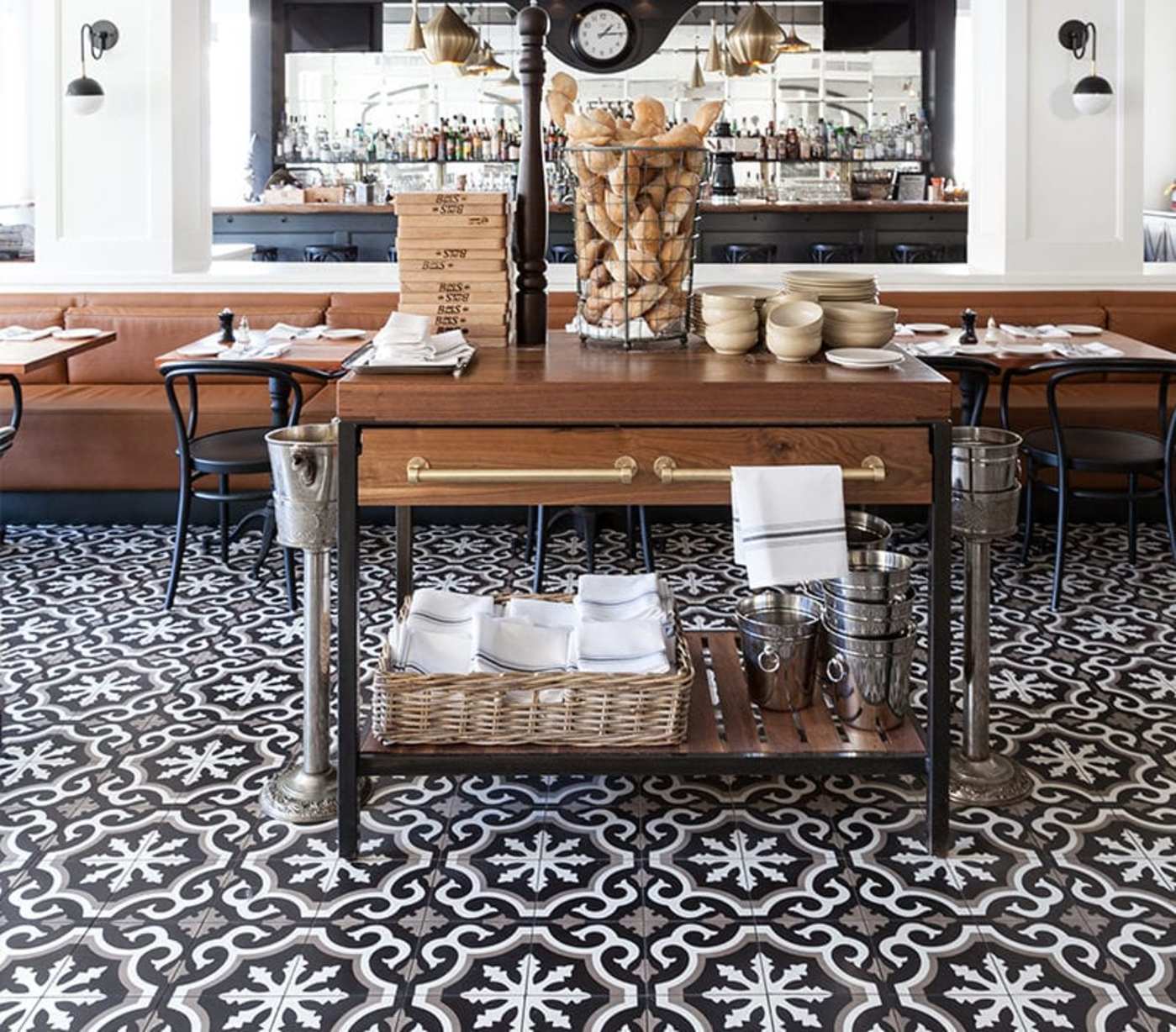 a black and white tiled floor in a restaurant.