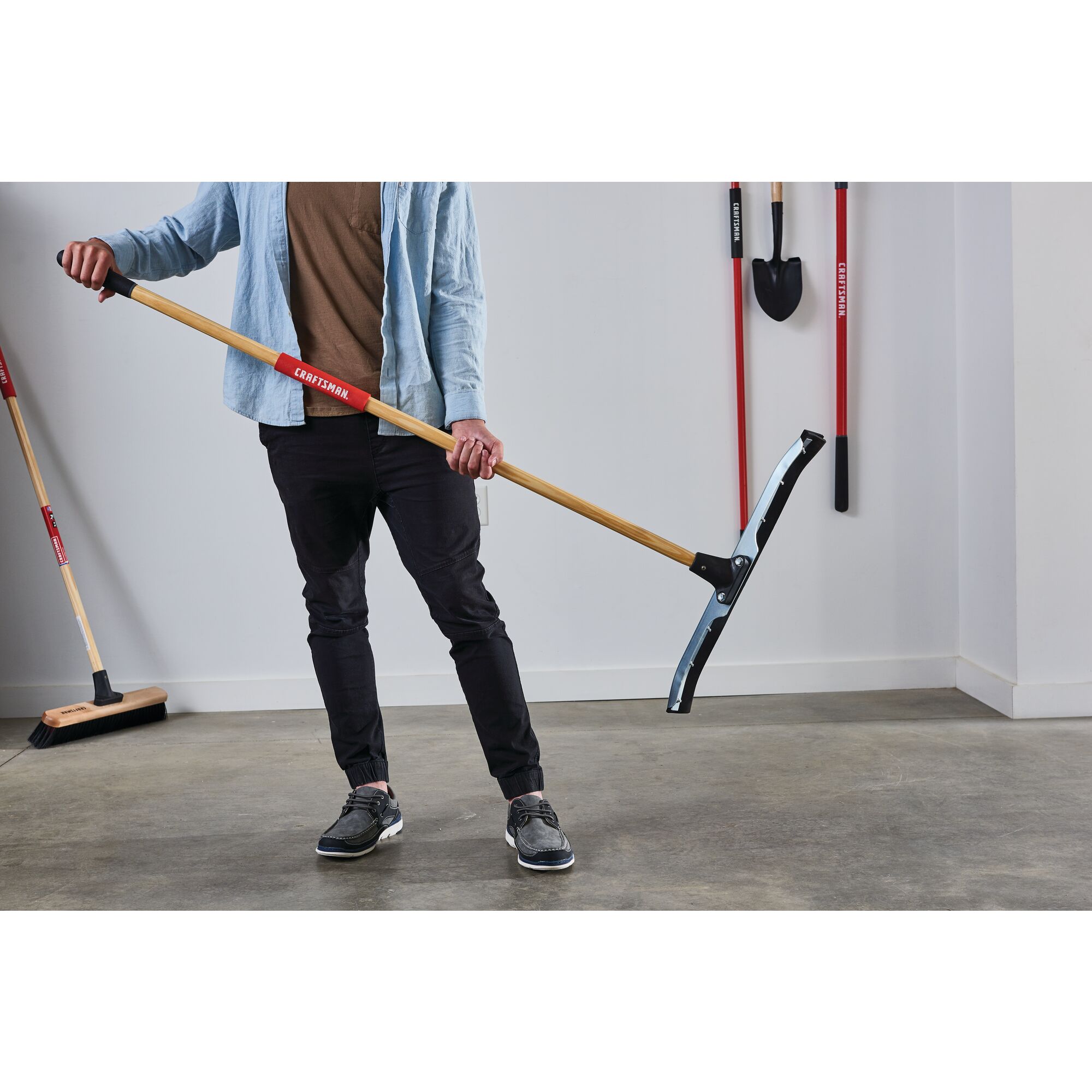 24 inch dual blade floor squeegee being used in a room.