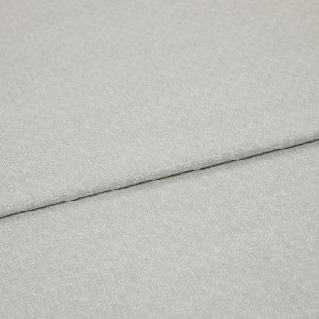 Light grey textured fabric panels overlapping slightly; top panel folded along a seam. Close-up view emphasizing woven pebble pattern, soft matte lighting, minimal background, studio-like neutral setting.