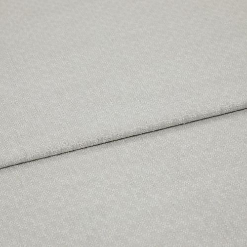Light grey textured fabric panels overlapping slightly; top panel folded along a seam. Close-up view emphasizing woven pebble pattern, soft matte lighting, minimal background, studio-like neutral setting.