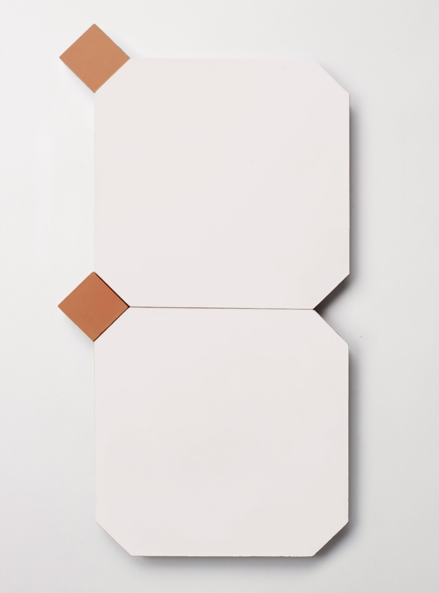 a set of white octagonal tiles and smaller red square tiles.
