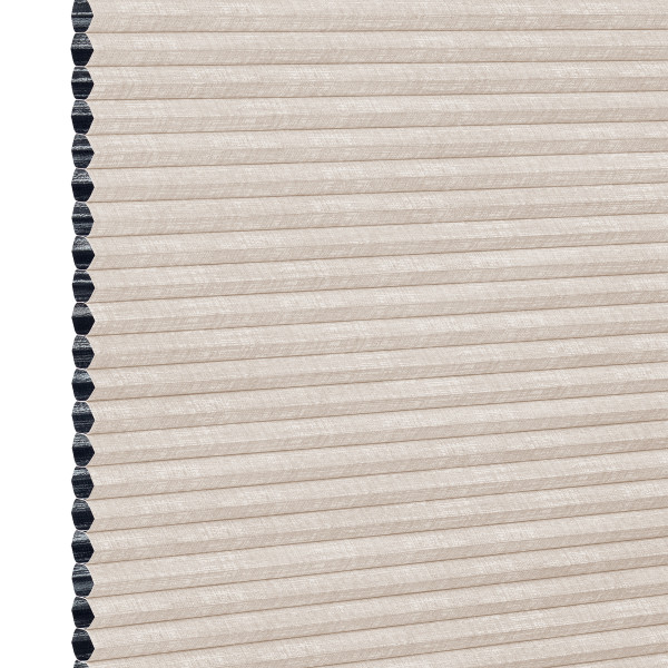 Beige cellular (honeycomb) window shade, pleated and fully lowered with exposed black cell openings along the left edge, blocking light and showing a textured fabric surface against a white background.