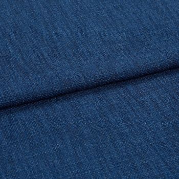Blue textured upholstery fabric (tight weave) folded across the frame, showing a horizontal crease; close-up studio-lit view emphasizing coarse threads and uniform deep-blue color.