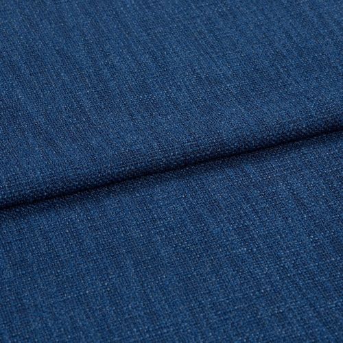 Blue textured upholstery fabric (tight weave) folded across the frame, showing a horizontal crease; close-up studio-lit view emphasizing coarse threads and uniform deep-blue color.