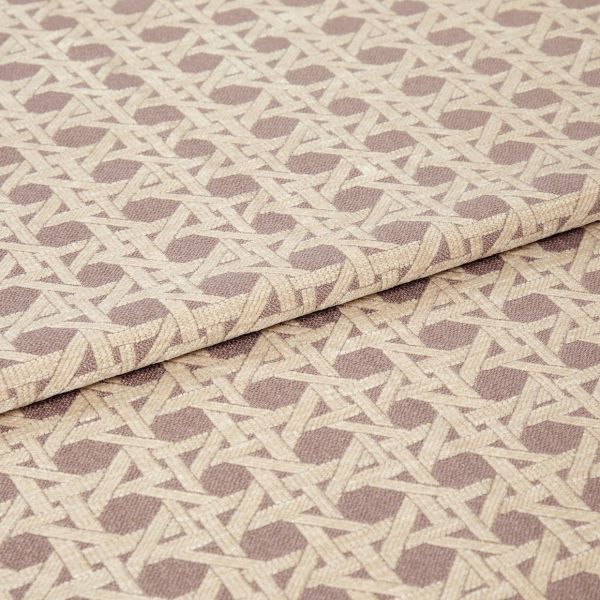 Woven upholstery fabric, beige and taupe geometric lattice with octagonal motifs, folded over itself; lying flat to show texture and pattern in a close-up studio product shot with soft lighting.