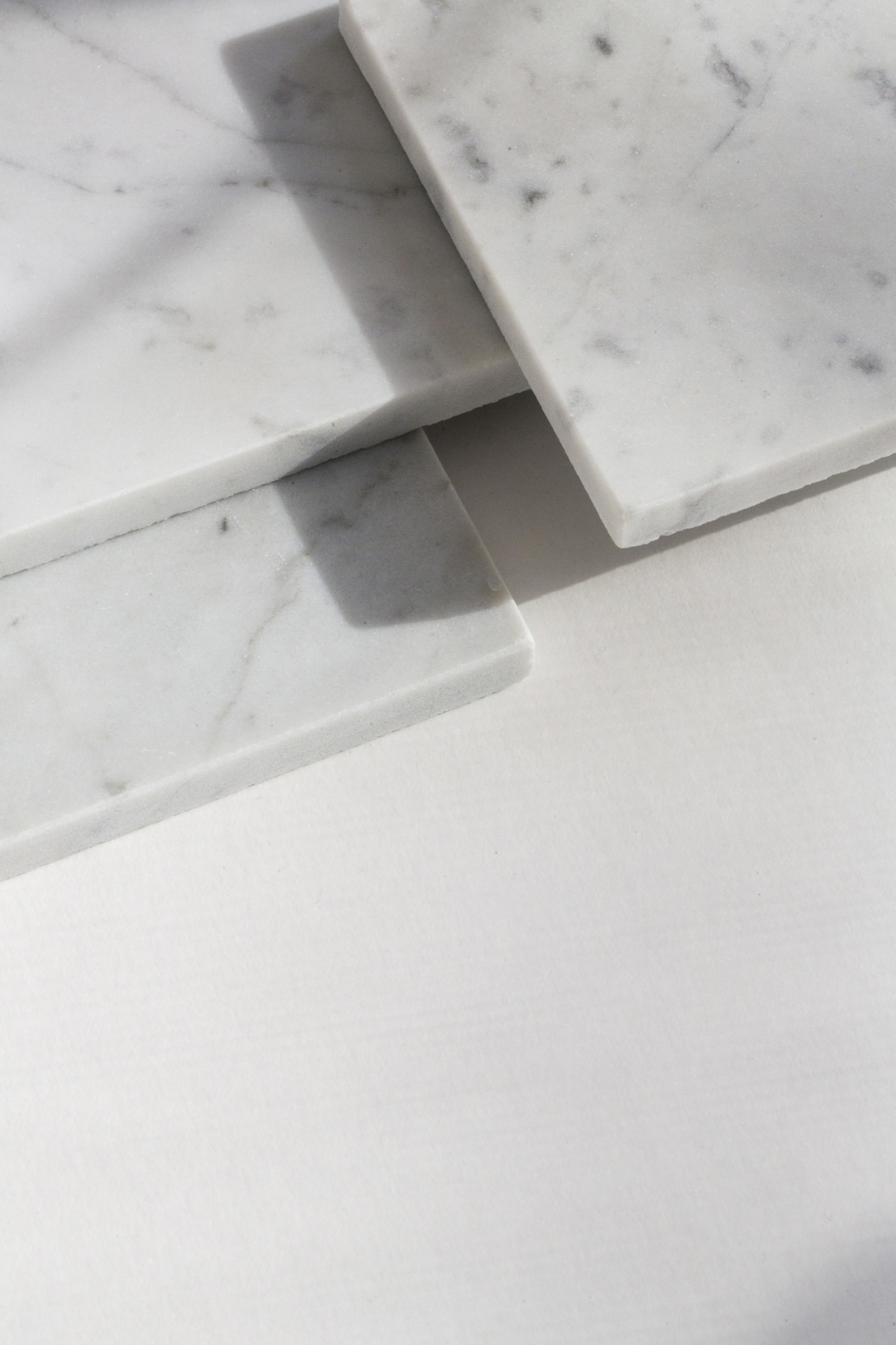 white marble slabs on a white surface.