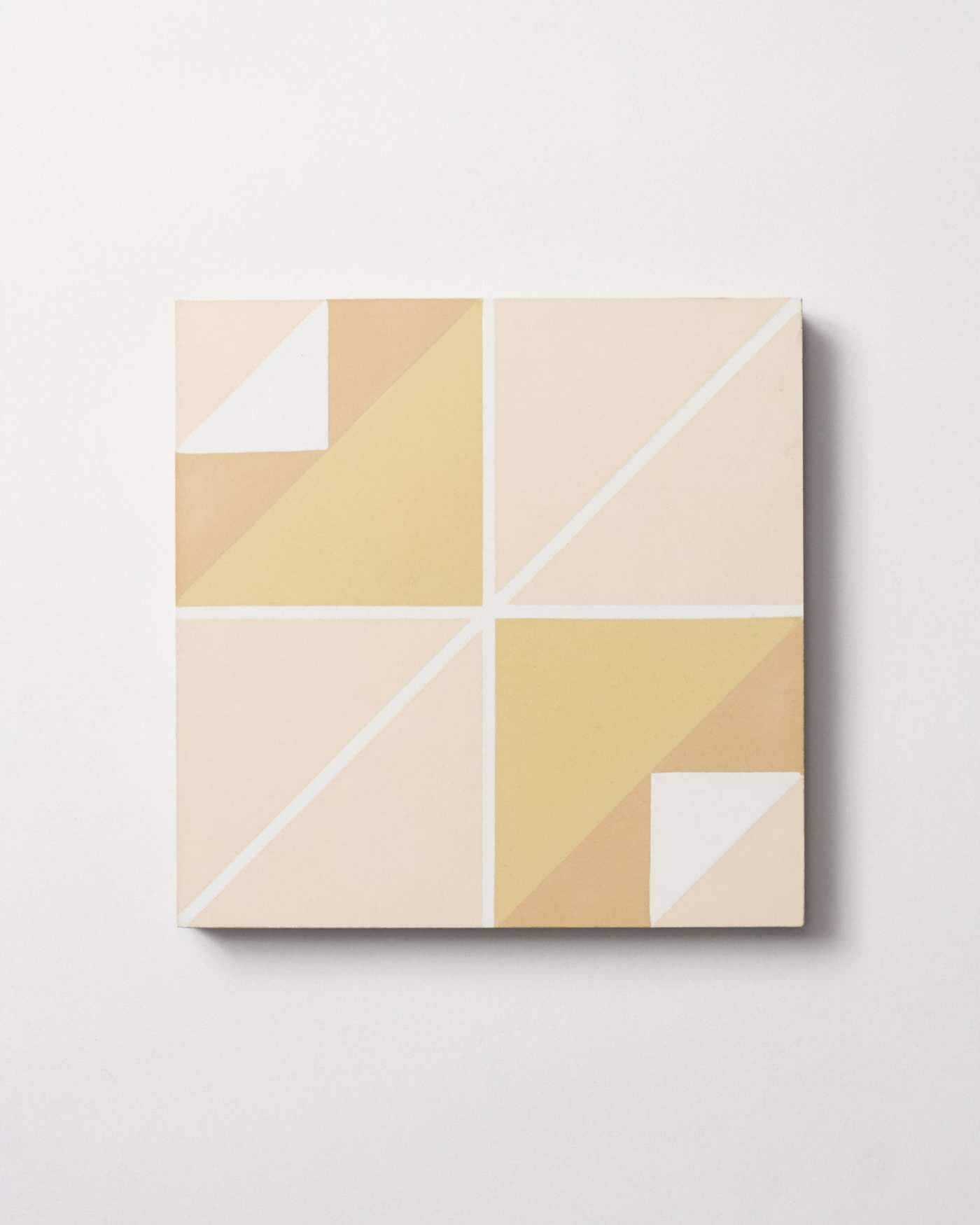 a yellow and beige tile on a white background.