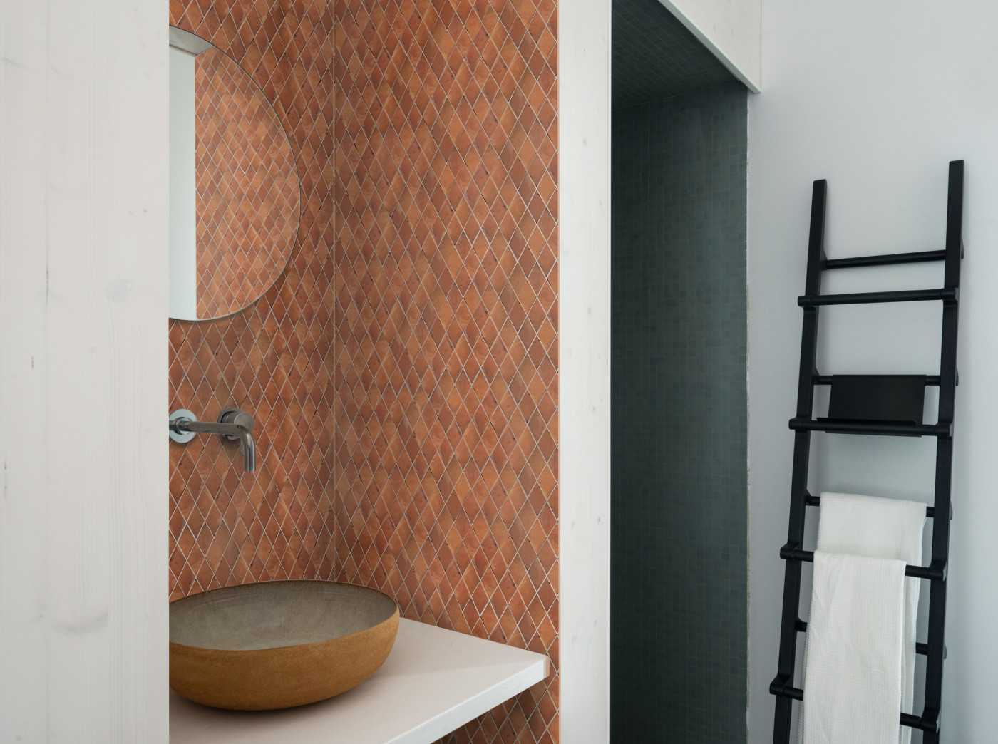 a bathroom with a sink and tiled backsplash.