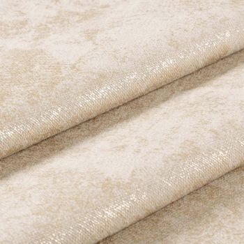 Folded beige upholstery fabric with subtle gold metallic sheen and small-scale textured weave, overlapping diagonal folds shimmering under soft light, macro studio close-up with neutral background.