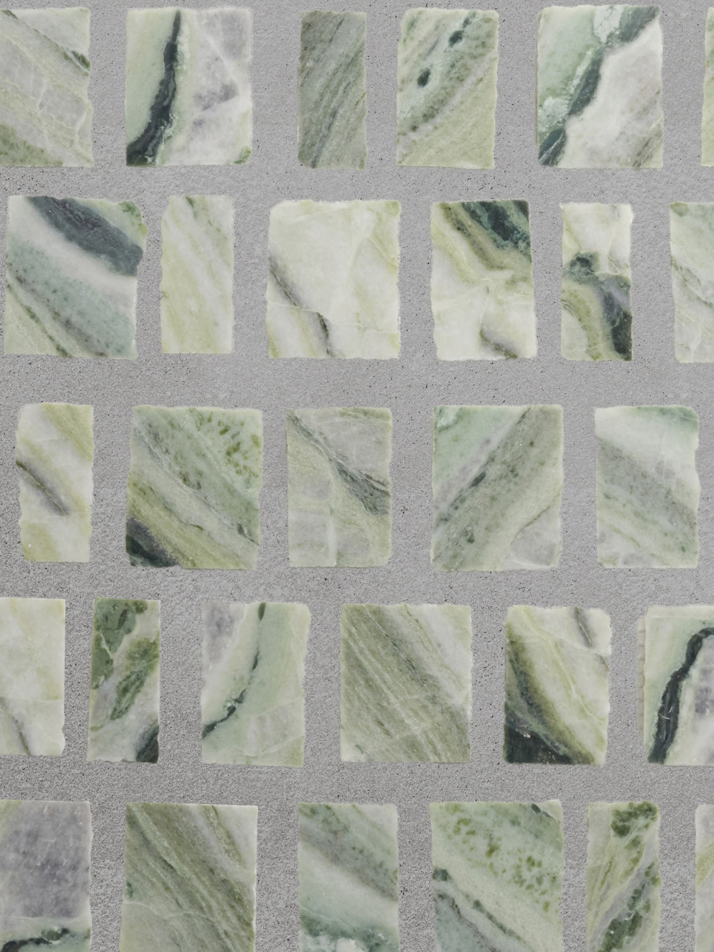 green marble mosaic tiles on a gray surface.