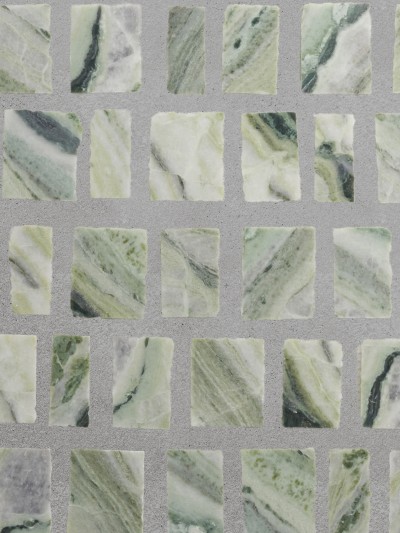 green marble tiles on a gray surface.