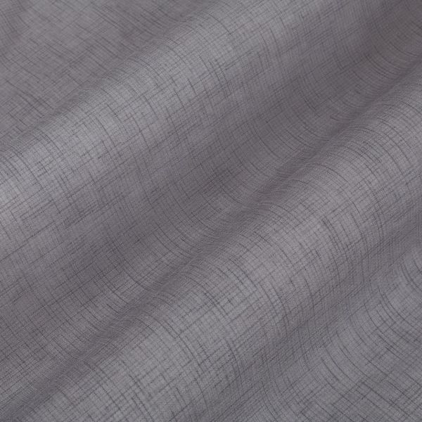 Textured gray curtain panel with fine crosshatch pattern, draped in soft vertical folds, gently filtering light against a neutral, softly lit interior.