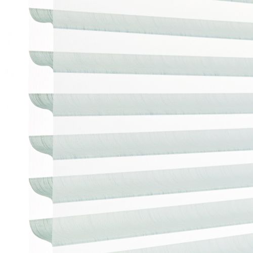 Layered horizontal zebra blind with alternating pale aqua translucent and opaque white fabric stripes, hanging lowered; filtering daylight and softly diffusing light in a bright, minimal indoor setting.