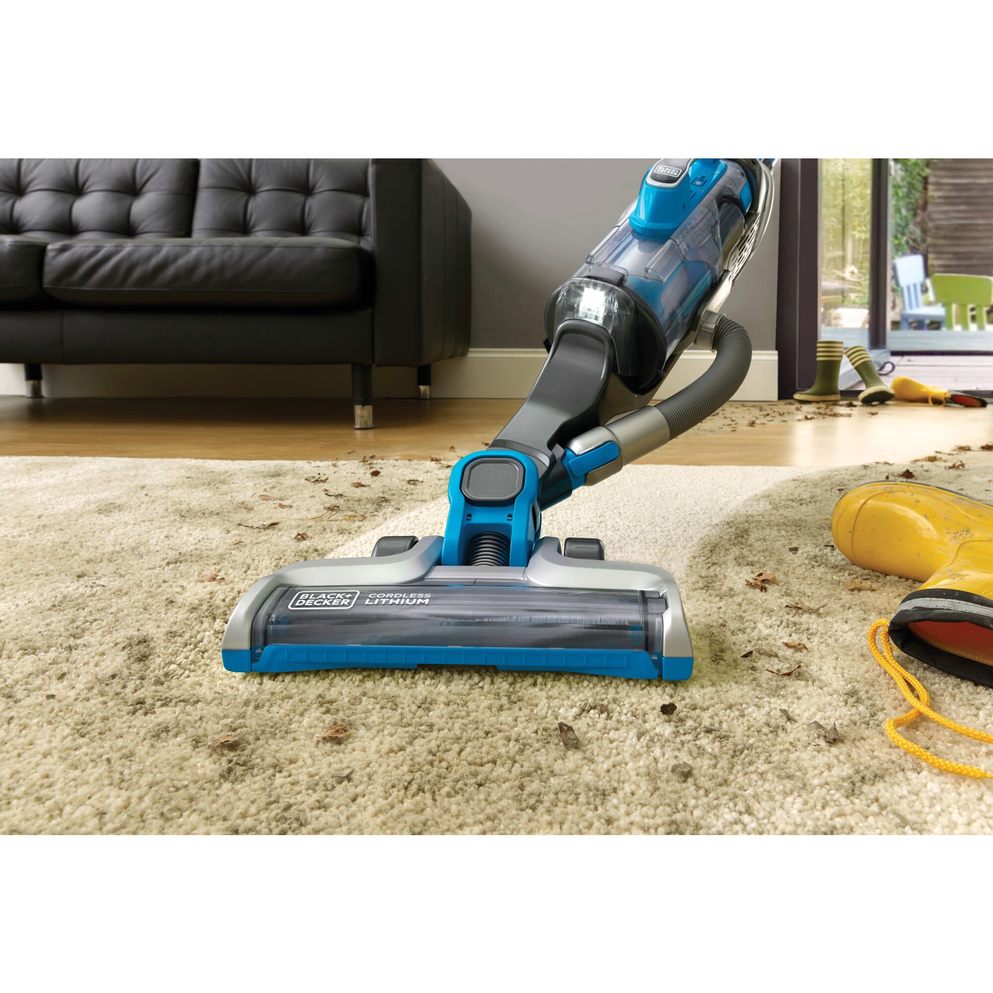 POWER SERIES PRO cordless 2 in 1 vacuum being used by a person to clean carpet.