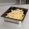 Half-size 2 ½-inch-deep Super Pan V® stainless steel steam table pan with Steel Coat x3™ nonstick coating