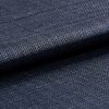Dark navy woven fabric, tightly woven and folded over itself; its textured basket weave catches a subtle sheen, shown in a close-up macro view with soft, even lighting.