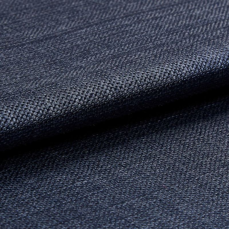 Dark navy woven fabric, tightly woven and folded over itself; its textured basket weave catches a subtle sheen, shown in a close-up macro view with soft, even lighting.