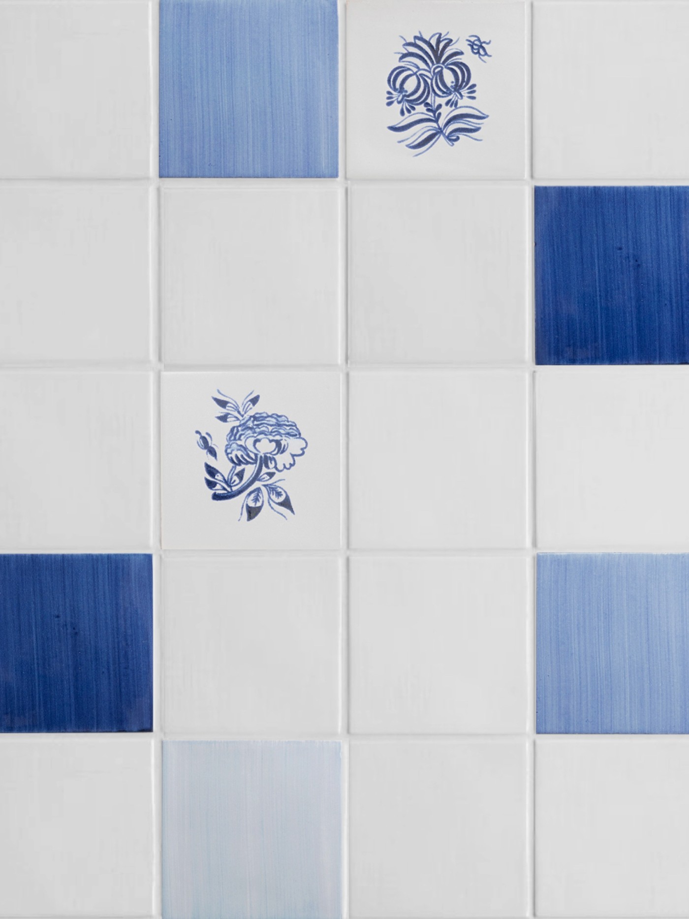 blue and white tiles with designs on them.