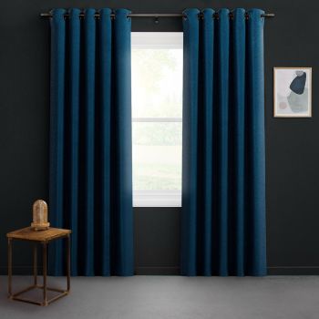 Floor-length navy grommet curtains on a metal rod, parted to reveal bright daylight through a white-framed window; dark-gray room with a small wooden side table and framed abstract art.
