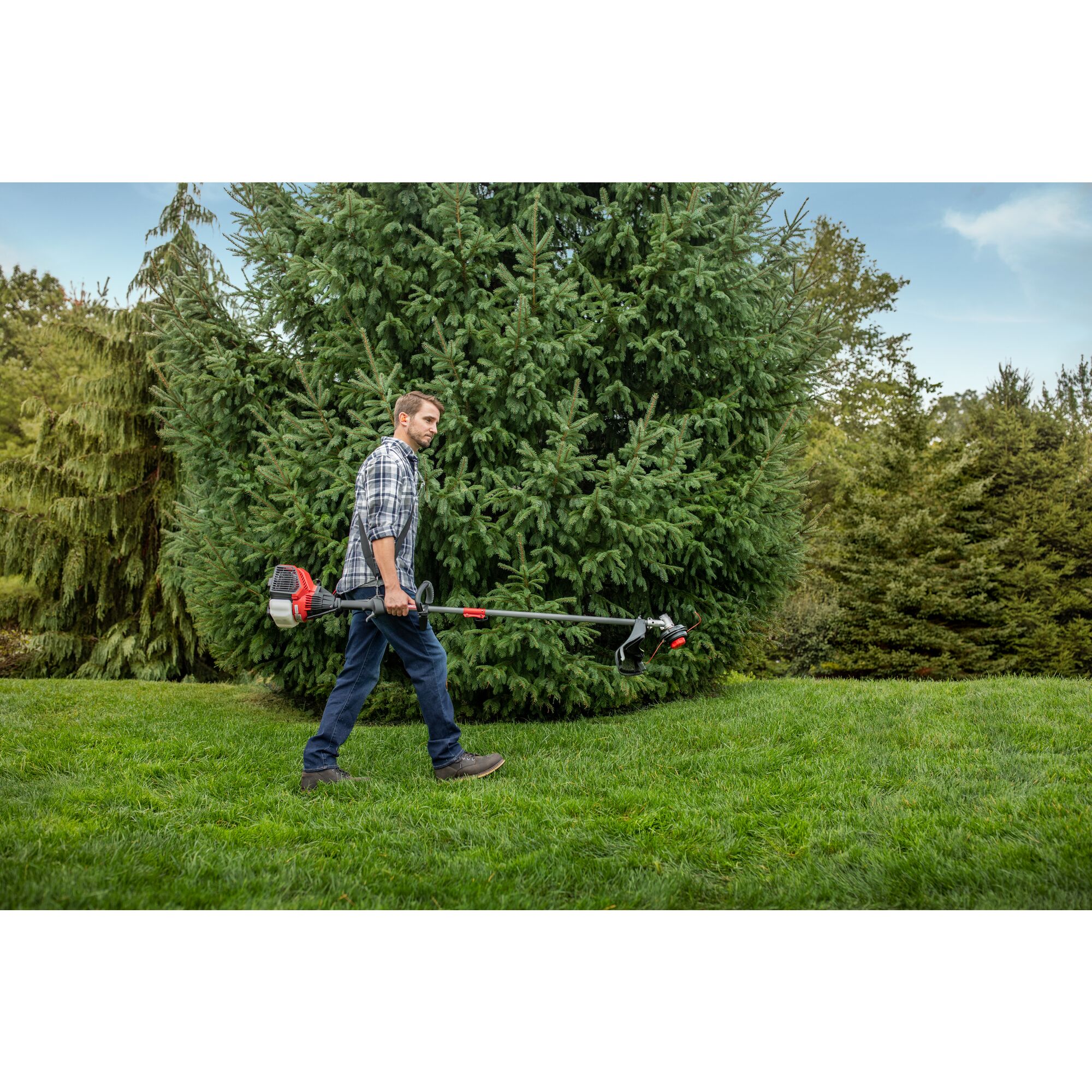CRAFTSMAN WS4200 WEEDWACKER being carried across yard with plaid shirt