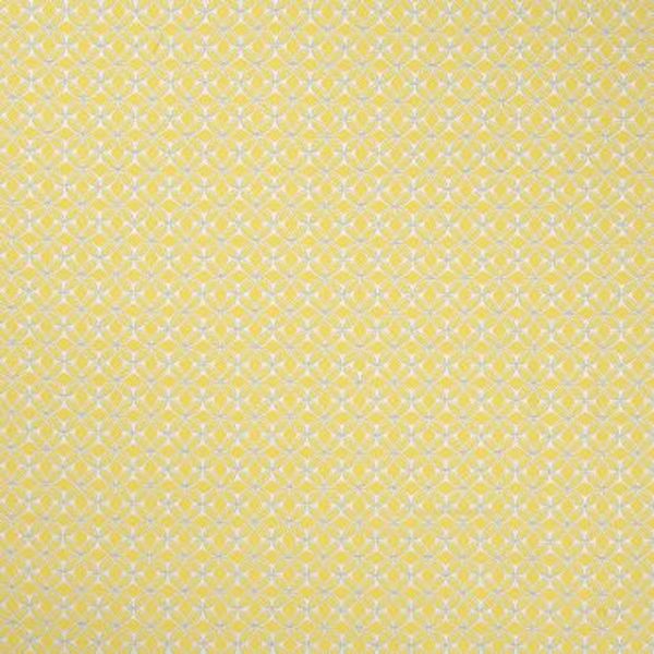 Pale yellow wallpaper with a dense white quatrefoil‑flower lattice (object), covering a flat wall continuously (action), close-up interior view, evenly lit, no other features visible (context).