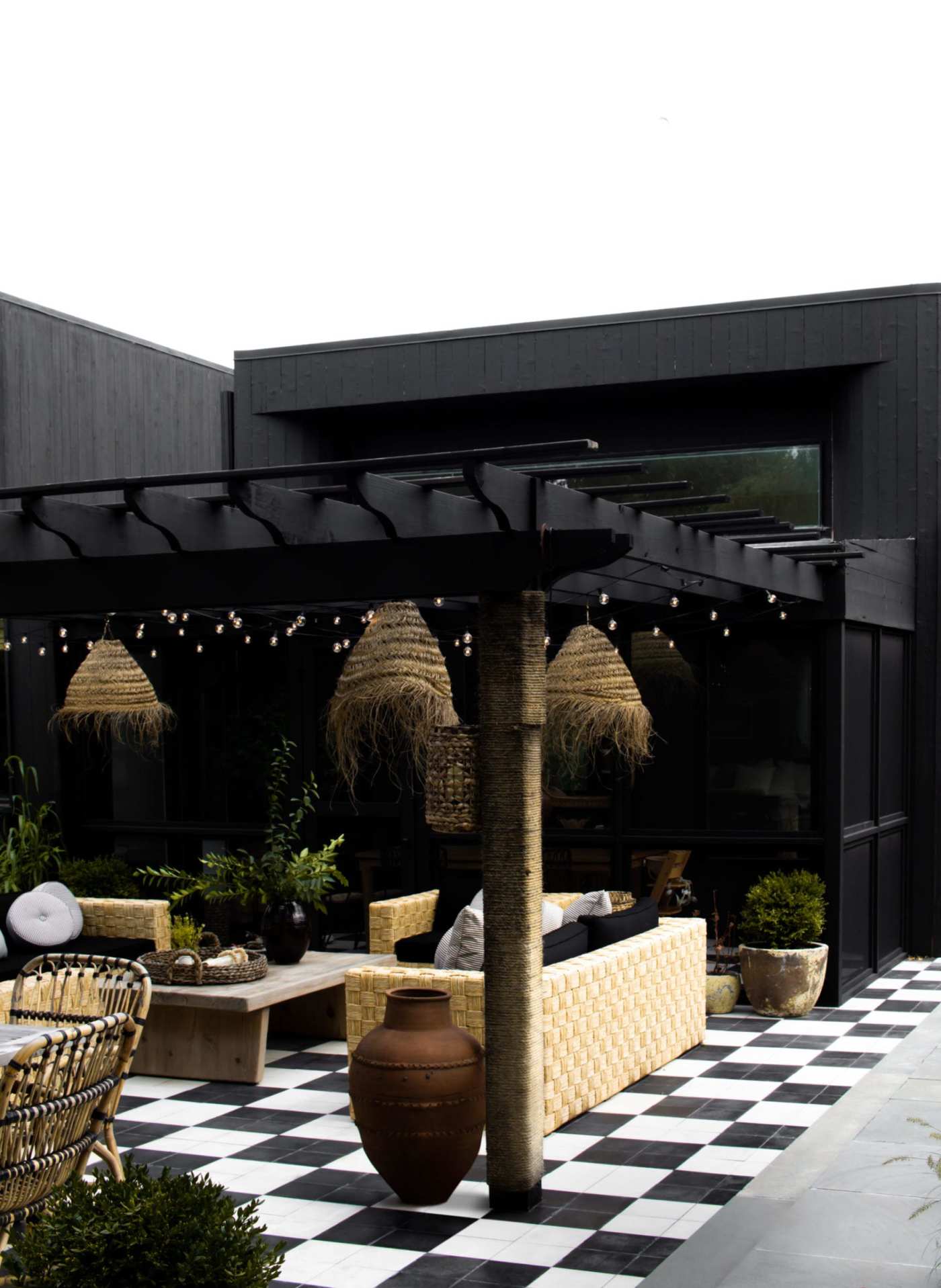 a patio with a black and white checkered floor.