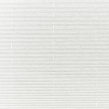 White pleated cellular blinds, fully lowered across the window with three vertical beaded cord ladders, closed and diffusing soft daylight into a neutral, minimally furnished interior.
