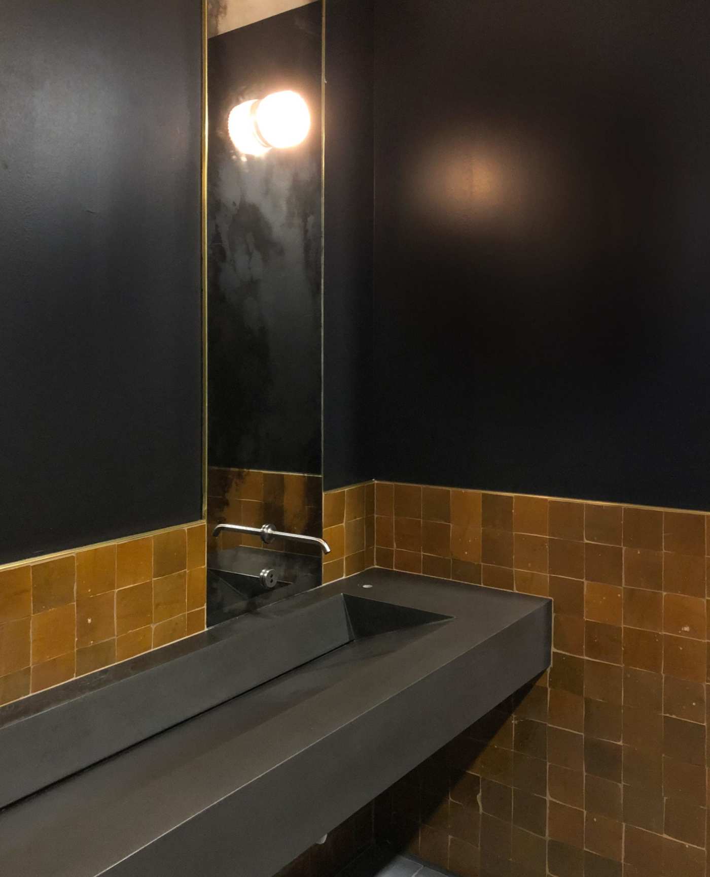a bathroom with a sink and a mirror.