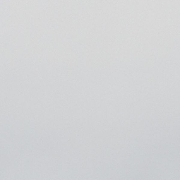 Light-gray textured wall occupying the frame, appearing blank and unadorned; evenly lit by soft, diffuse light with no visible furniture or other features.