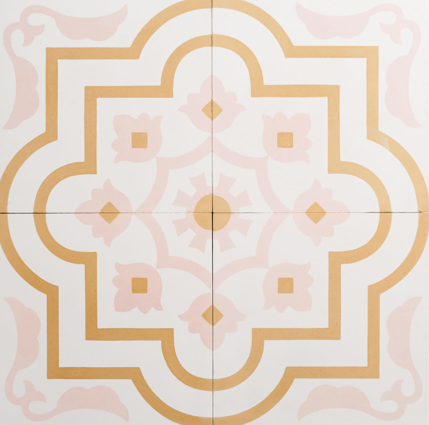 four white tiles with a pink and gold designs.