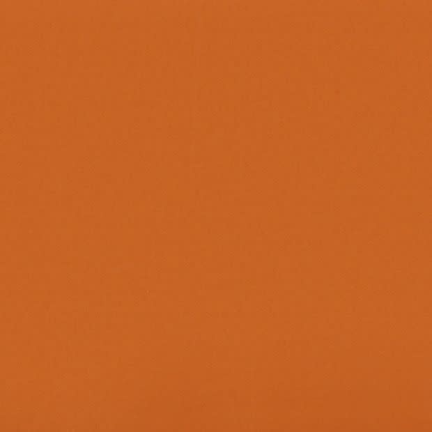 Solid orange textured fabric filling the frame, lying flat and uninterrupted; evenly lit with a smooth, subtle weave visible, suggesting a textile or painted wall under soft, diffuse light.