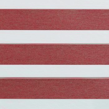 Horizontal dual‑fabric blinds with wide maroon textured opaque bands alternating with translucent white bands; positioned lowered, blocking and diffusing light in an interior setting with no visible view.