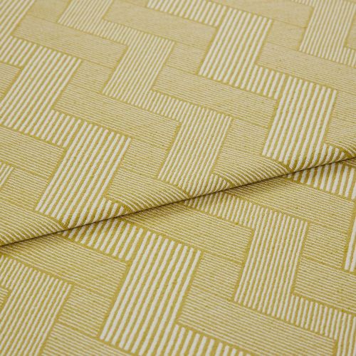 Folded mustard-yellow woven fabric with white narrow-striped, interlocking rectangular (herringbone-like) pattern â€” folded once â€” shown close-up on a flat surface under soft, neutral studio lighting.