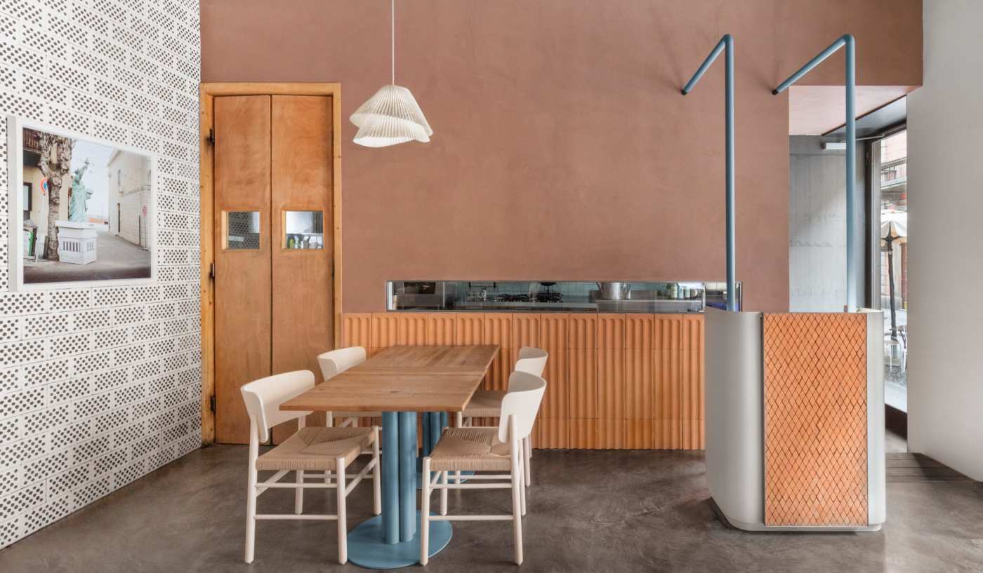 a dining room with a wooden table and chairs.