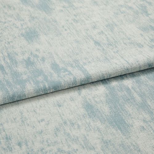 Light blue and off-white mottled woven fabric (object), folded with a visible hem and layered on itself (action), close-up studio shot with soft, even lighting showing subtle texture (context).
