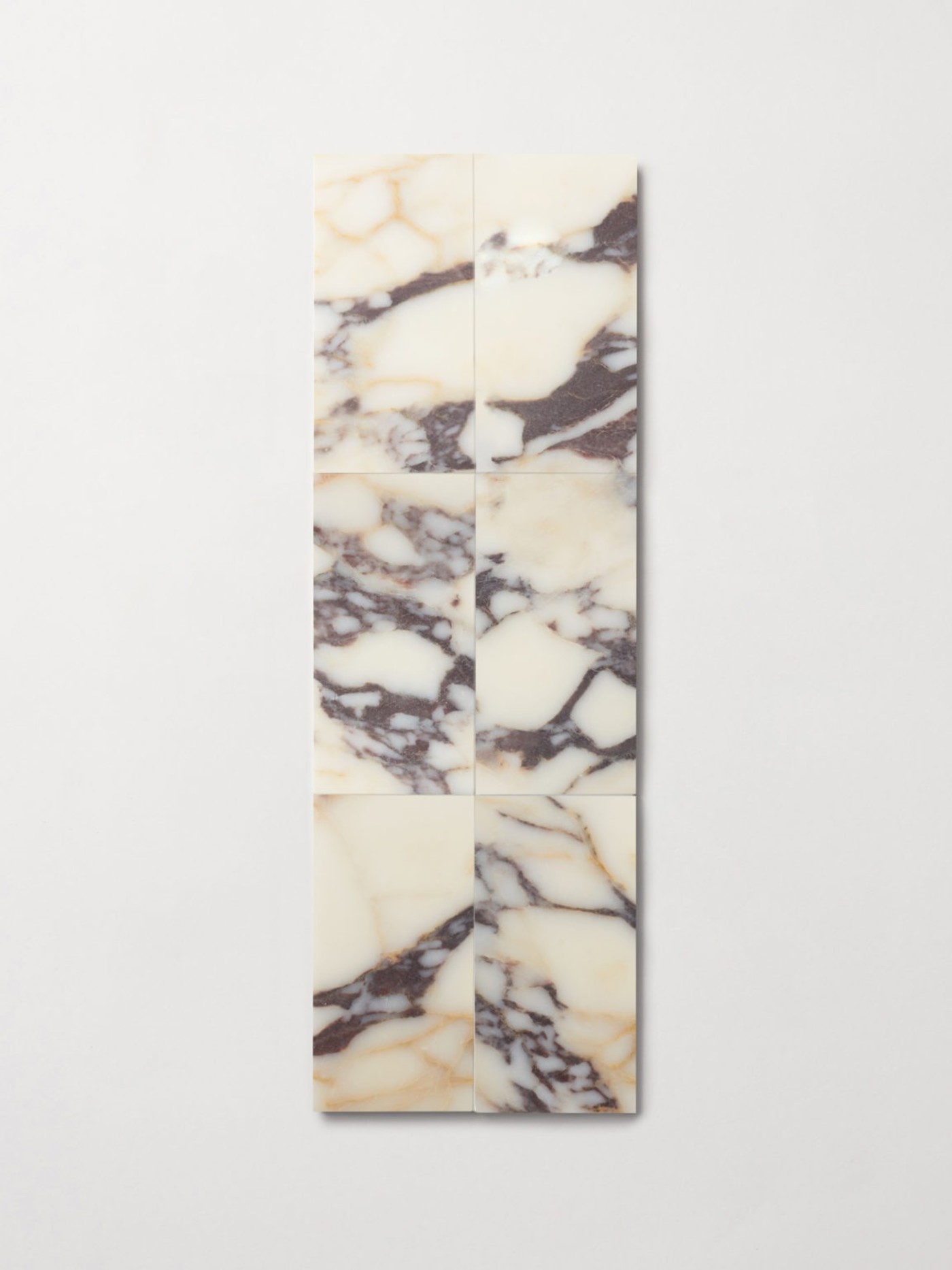 marble tiles arranged on a white surface.