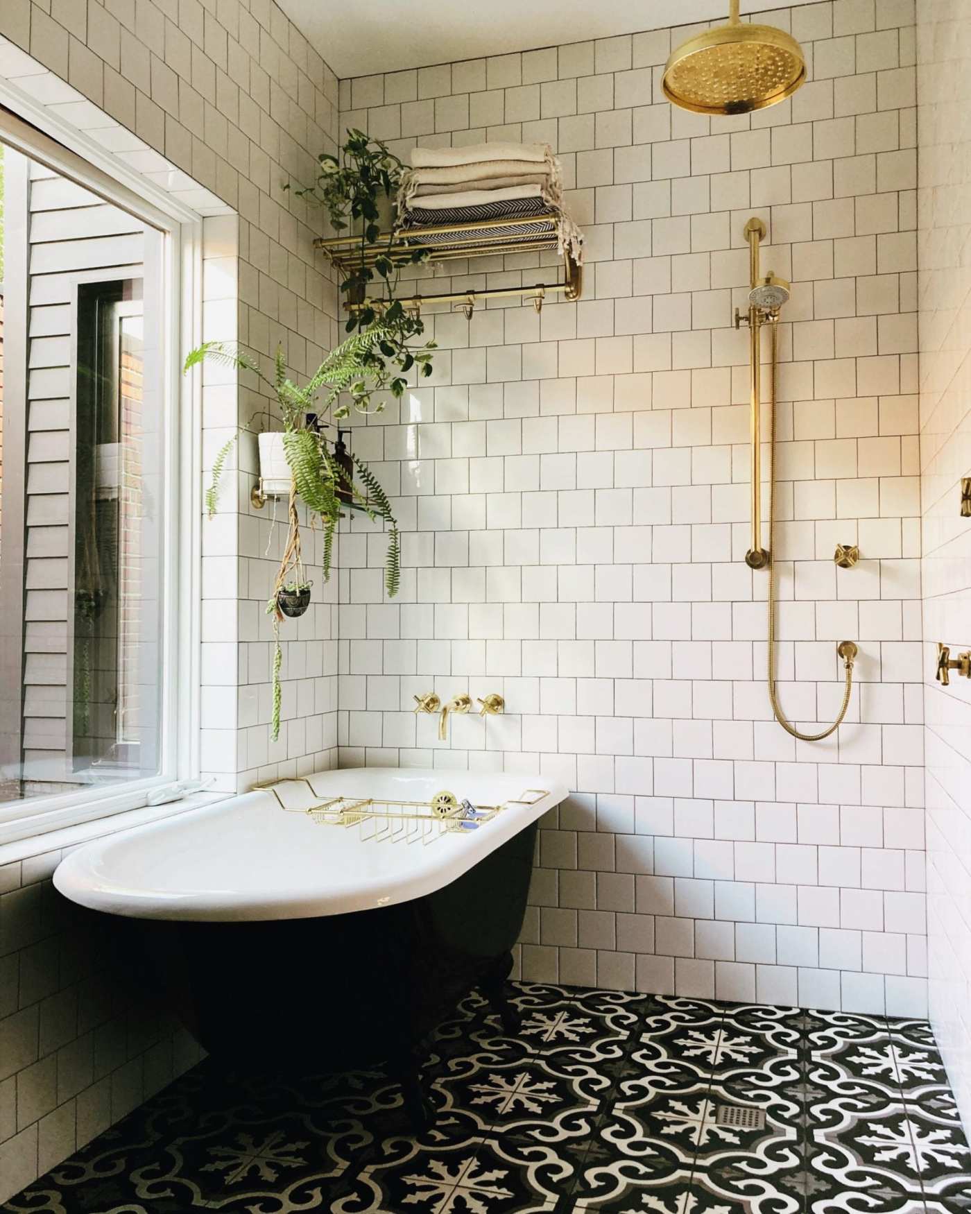 a bathroom with a black and white tile floor.