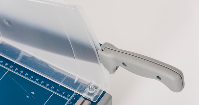 Fingers are shielded from the blade for safety.