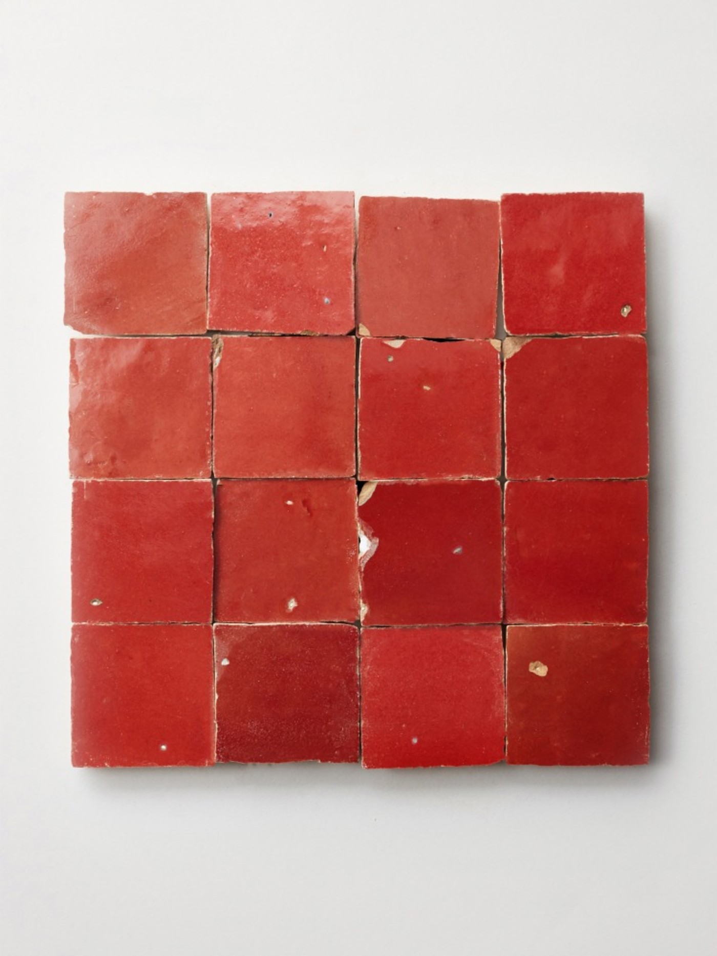 red tiles on a white surface.