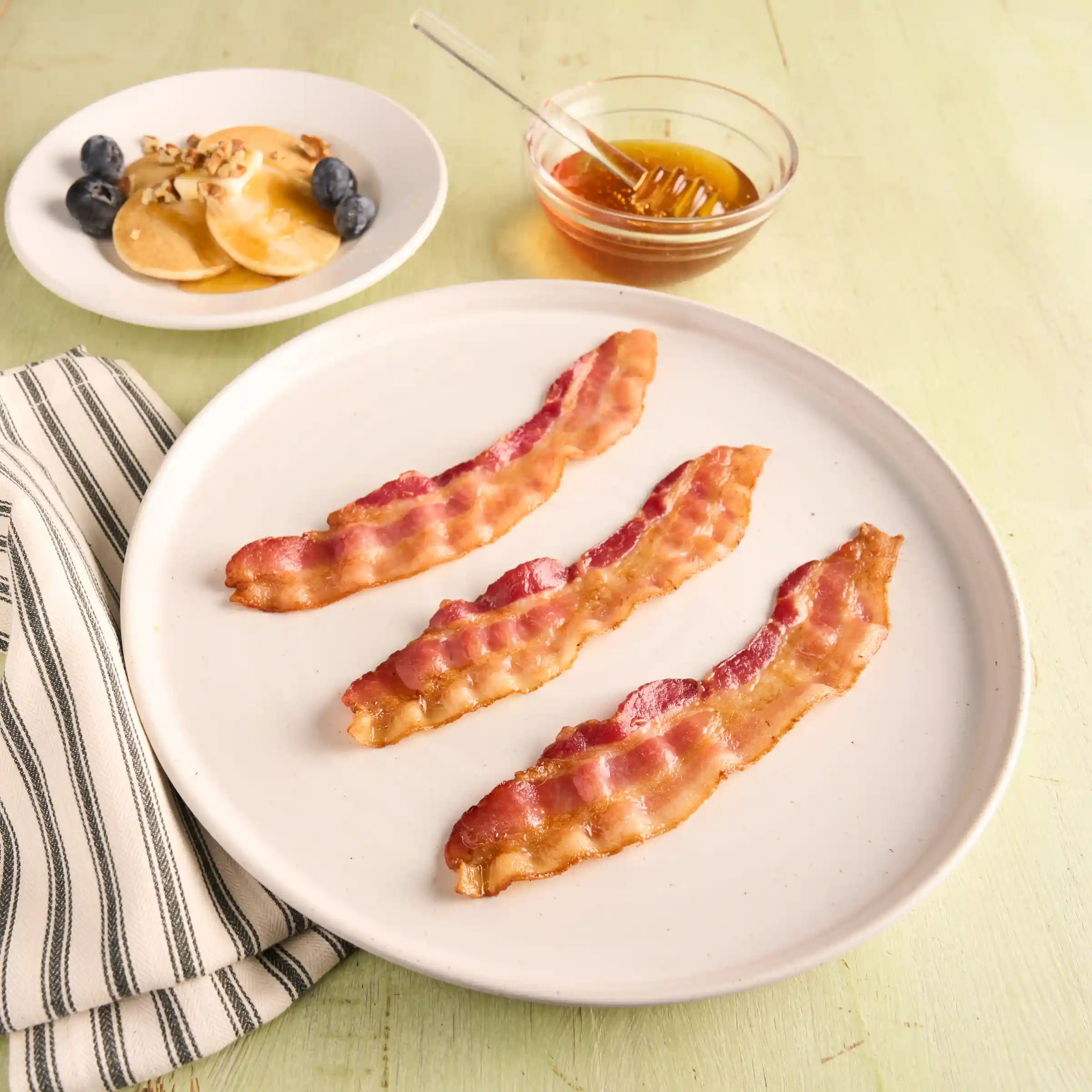 Wright® Brand Hickory Smoked Honey Thick Sliced Flat-Pack® 14/16 Bacon https://images.salsify.com/image/upload/s--cW2ae4G4--/q_25/101f216bec9fa9f2916cbe688e7bc6151e58be83.webp
