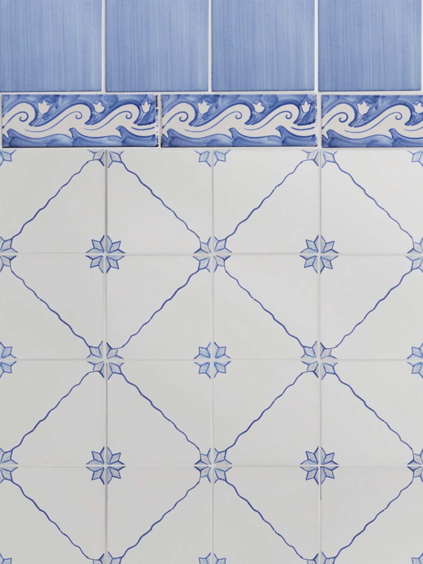 blue and white tiles with designs on them.