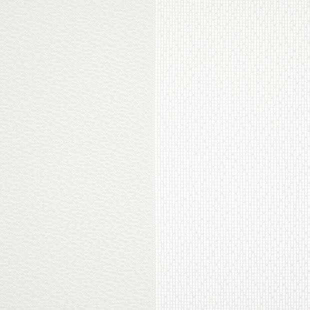 Two adjacent wallpaper panelsâ€”left smooth off-white, right white with a fine rectangular gridâ€”meet at a central seam, displayed as sample swatches under soft, neutral lighting.