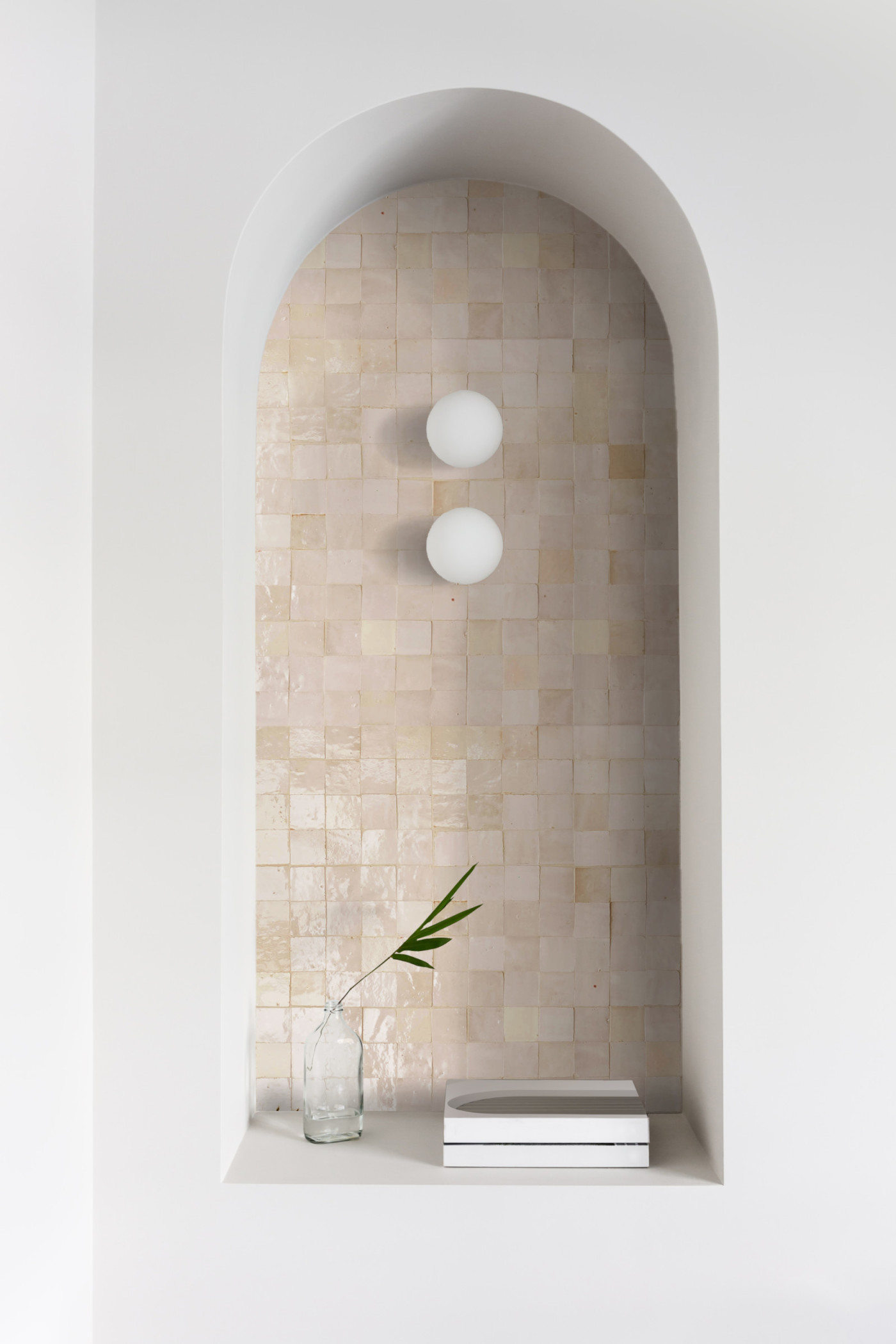 a tiled alcove in a white wall.