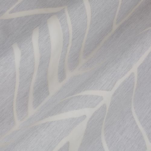 Pale gray curtain fabric with white abstract leaf pattern, draped in soft diagonal folds; fabric appears slightly textured and creased, shown in a close-up under soft, neutral indoor lighting.