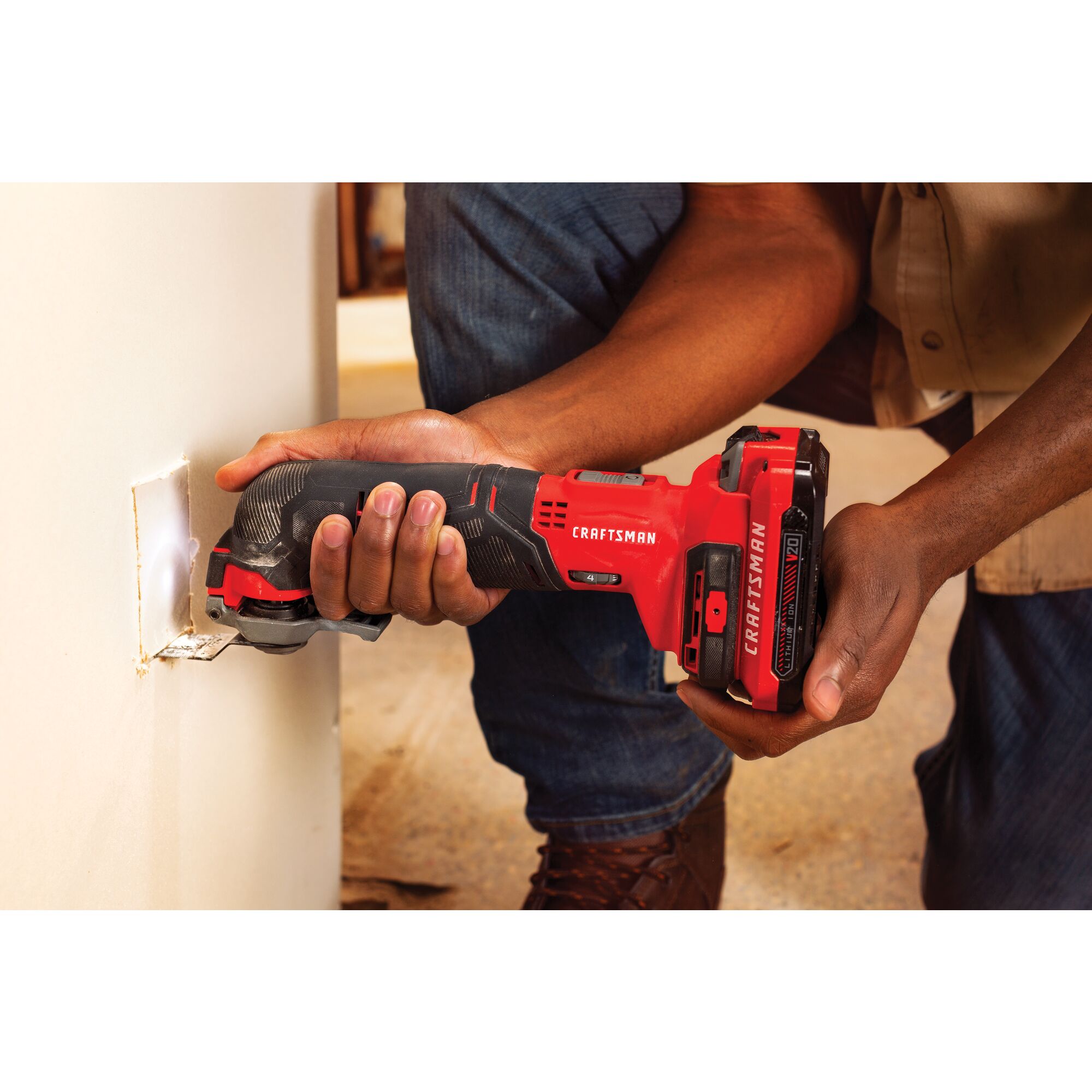 Cordless oscillating tool kit being used.