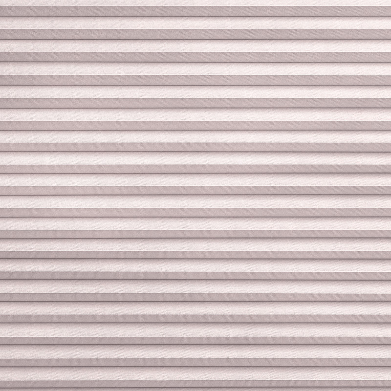 Pleated fabric blinds, horizontal pleated folds, fully closed, gently diffusing soft daylight; mounted over a window in a neutral-toned interior, creating uniform, muted light and textured pattern.