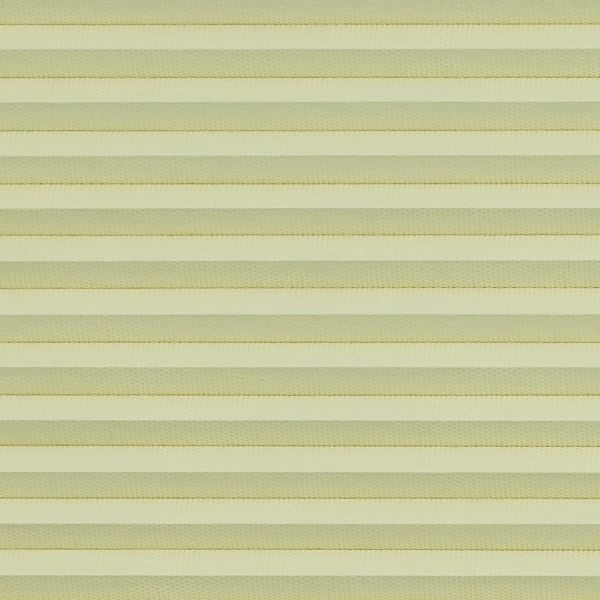 Honeycomb cellular blind with horizontal pleats, fully lowered and closed, diffusing soft daylight; close-up interior view showing uniform pale-yellow bands filling the frame.