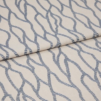 Beige fabric with repeating blue rope-like chain pattern, folded and layered across itself; close-up on a flat surface with soft, even lighting that emphasizes the woven texture.